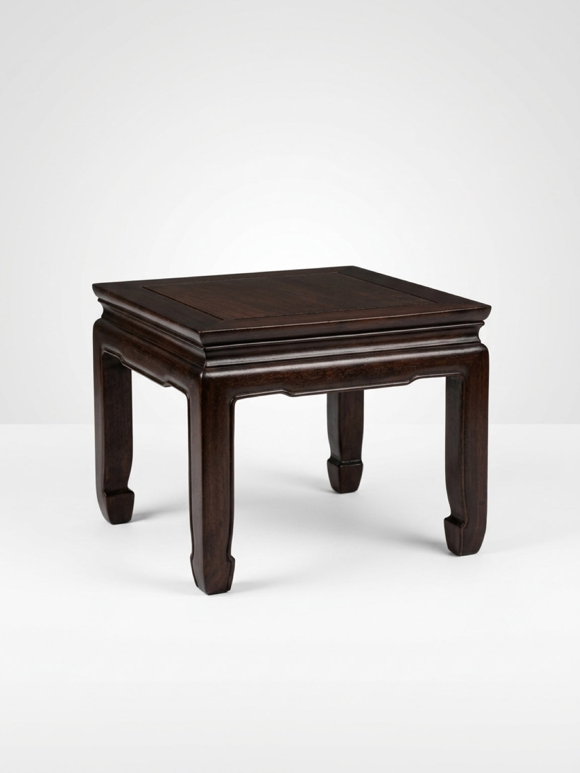 Square dark hardwood Ming-style low table with traditional inward-curving horse-hoof feet and a waisted apron frame, isolated on a clean white background.