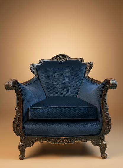 Blue upholstered armchair with ornate wooden frame on a beige background