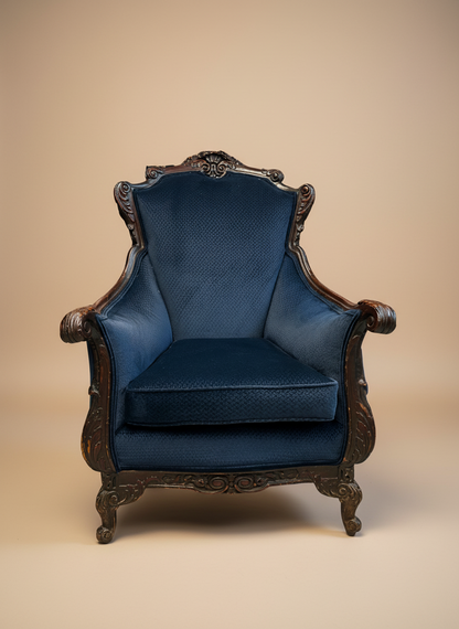 Blue armchair with wooden frame on a beige background