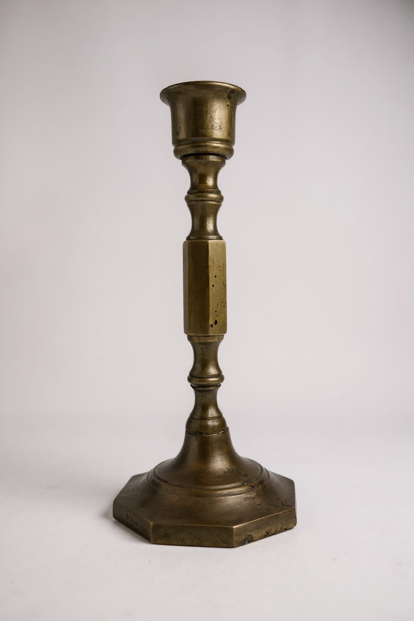 Brasscandlestick on a white background front view


