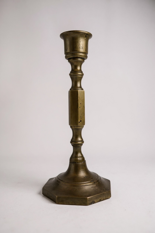 Brasscandlestick on a white background front view


