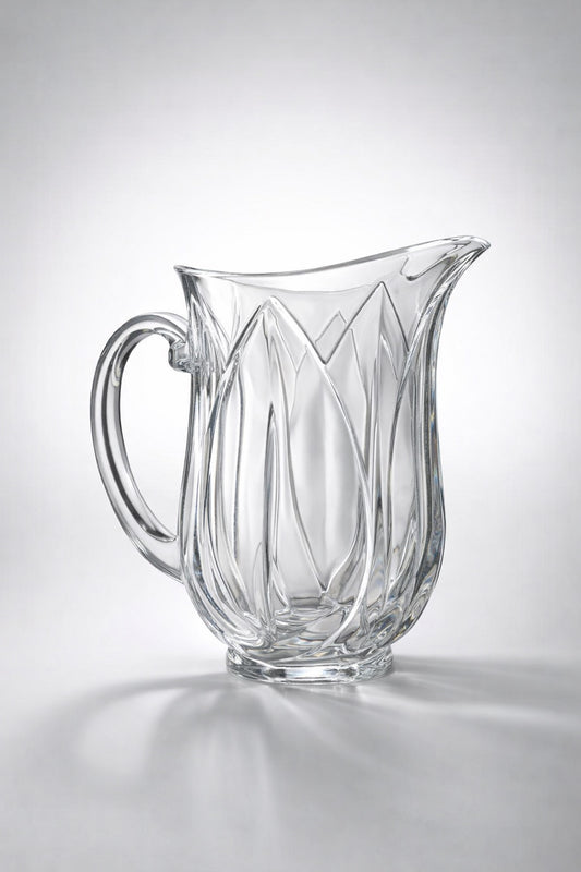 Clear glass pitcher with decorative design on a gray background - Vintage Cristal d'Arques "Pompano" Glass Pitcher | Pressed Glass Tulip Pattern | Made in France