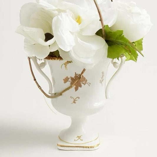 Vintage floral arrangement in urn With white flowers mix