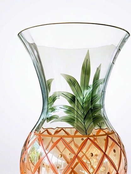 Vintage hand-blown Romanian crystal urn-shaped vase featuring a hand-painted amber pineapple lattice pattern, green fronds, and a gold-trimmed flared rim.⁠