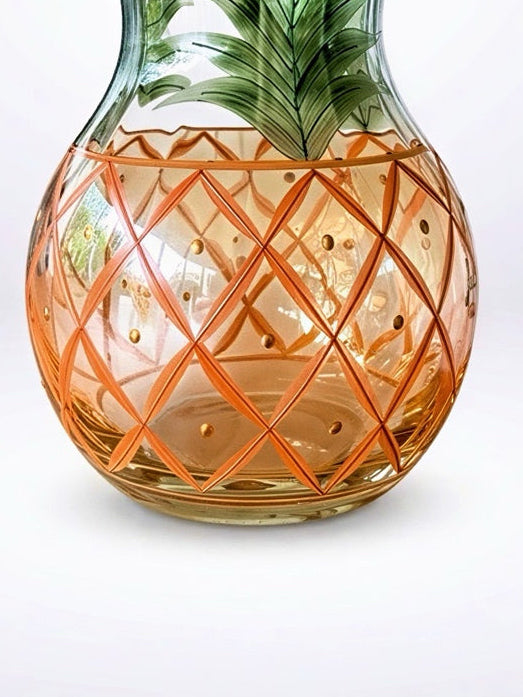 Vintage hand-blown Romanian crystal urn-shaped vase featuring a hand-painted amber pineapple lattice pattern, green fronds, and a gold-trimmed flared rim.⁠