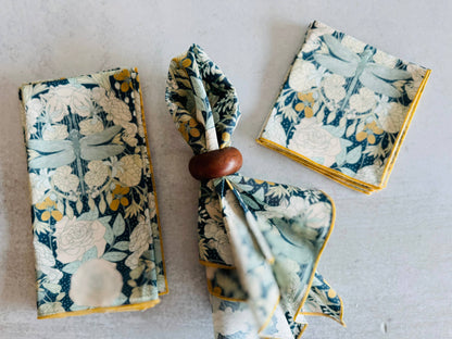 Set of floral napkins in blue and yellow, featuring dragonflies, made from soft cotton fabric.