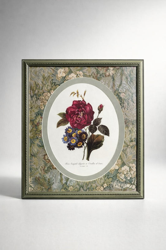 Framed botanical illustration of a rose and other flowers on a gray background