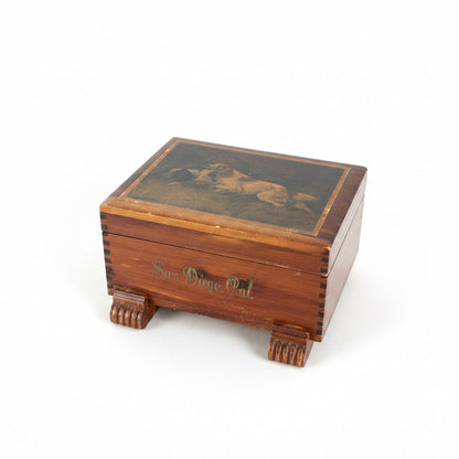 Side profile of vintage cedar keepsake box showing solid wood construction with exposed finger-joint corners and original brass back hinges