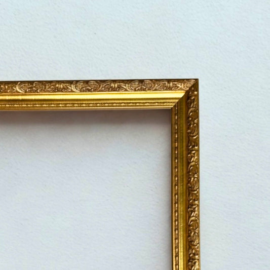 Gold ornate picture frame on a white background