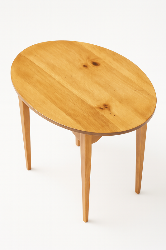 High-angle studio shot of a handcrafted solid hardwood oval side table with a clear natural grain finish and four tapered legs, isolated on a clean white background.