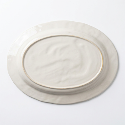 Underside of turkey platter