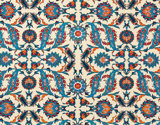 Close up of pattern on vibrant serving platter features an eclectic, Turkish-inspired symmetrical motif. 