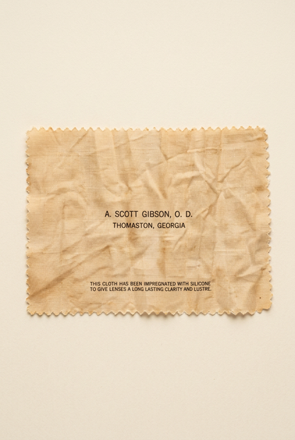 Vintage printed cleaning cloth on an ivory background