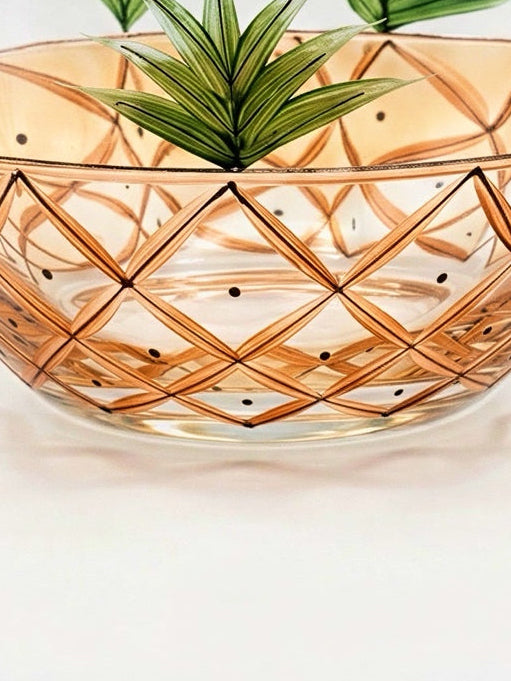 Vintage hand-blown Romanian crystal bowl featuring a hand-painted amber pineapple lattice pattern, green fronds, and a gold-trimmed rim by Crystal Clear Industries.⁠