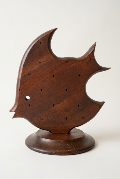  Vintage Takahashi wooden angelfish cocktail pick holder with pierced body, sweeping fins, and a worn round pedestal base.