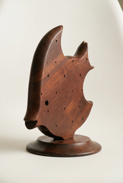 Angled view of Takahashi wooden angelfish holder showing its curved edges, pierced body, and reddish-brown wood finish.